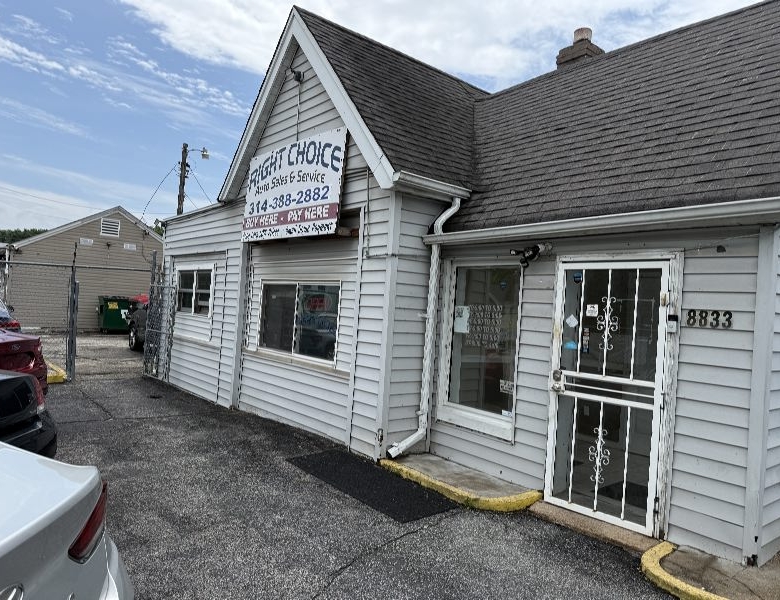 Small gray storefront with a peaked roof and a sign that reads 'Right Choice' over the front window, 8833 address visible on the side wall.